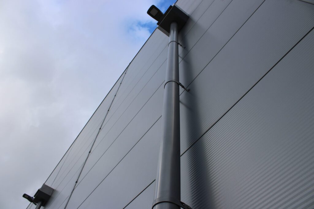 High-quality Alutech gutter downpipe systems for effective rainwater management in construction projects.